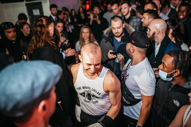 A fighter's ring walk through the Backyard Bouts crowd