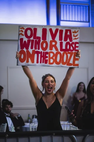A supporter holding up a homemade sign in the ballroom