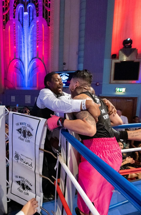 Jamie at the ropes on fight night, embracing someone in his corner