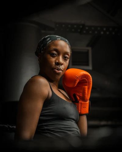 A fighter in her gloves before training