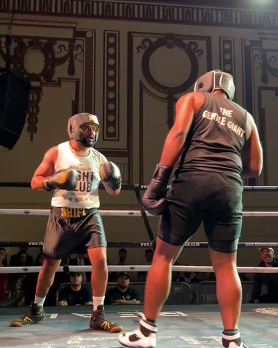 Two men in a boxing bout on fight night