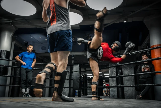 Fighters throwing kicks in a Muay Thai sparring session at Gymbox