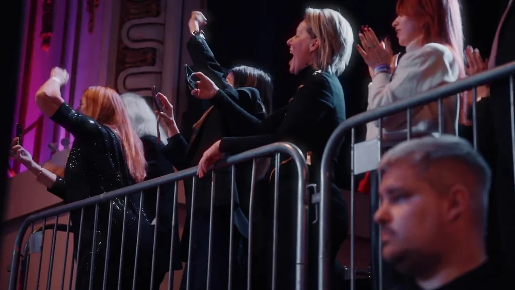 Supporters cheering at the barrier on fight night
