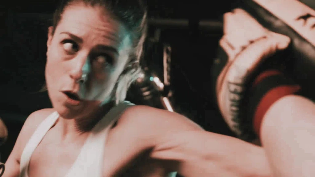 A fighter hitting the pads in training